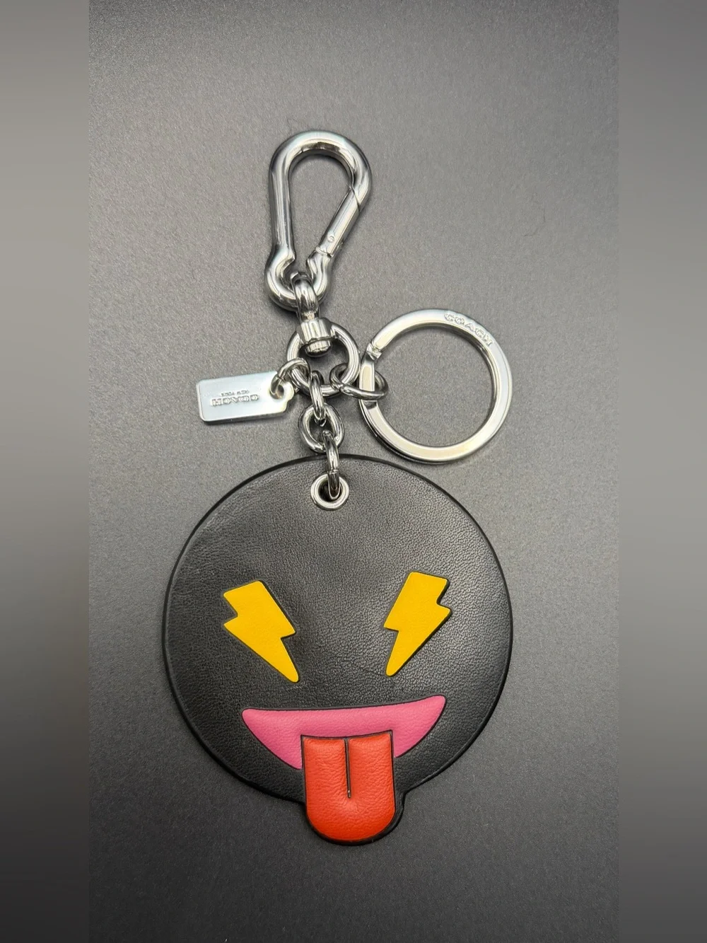 Coach Black Leather Emoji Keychain with Yellow Lightning Eyes & Red Tongue